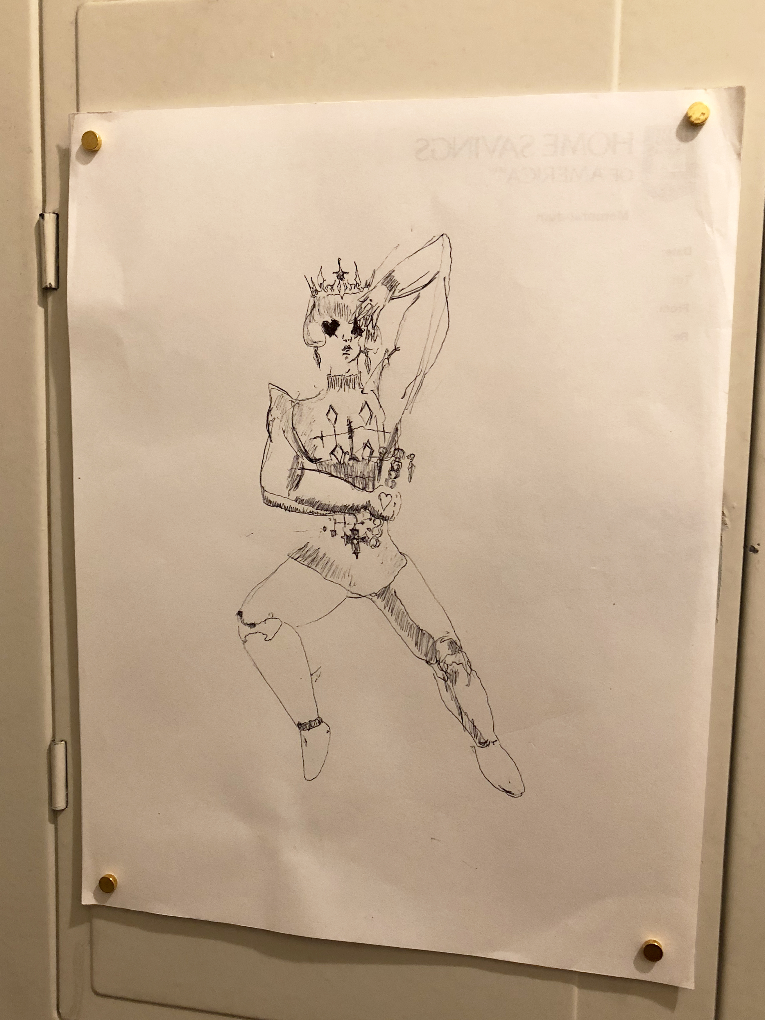 Detail of a drawing of a stylized prince character on white paper hung on an electrical box